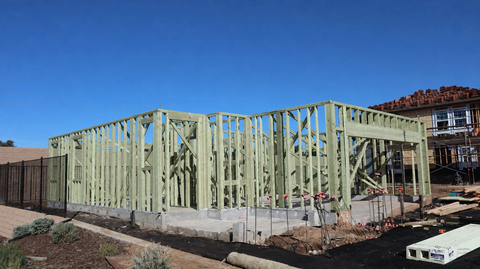 Authentic residential wall framing with subtly green treated structural lumber